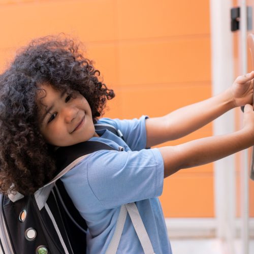 child opens school door, angry is late, back to school, preschool